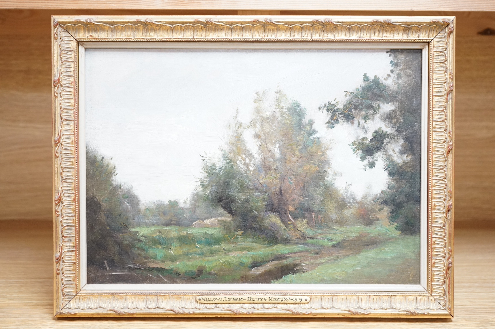 Henry G. Moon (1857-1905), oil on board, ‘Willows, Dedham’, signed in ink verso, applied plaque to the ornate gilt frame, 24 x 34cm. Condition - good